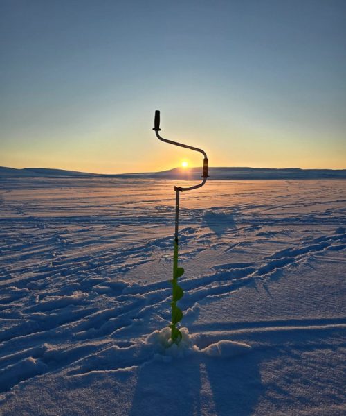 Ice drill stuck on the ice