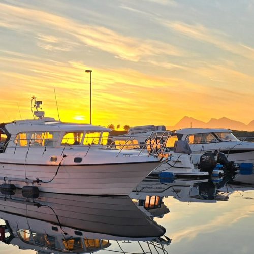 Boats at the habor with midnight sun